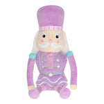 Lavender Nutcracker plush toy with faux fur, fleece, glitter embroidery, and pastel accents, measuring 18 inches tall.