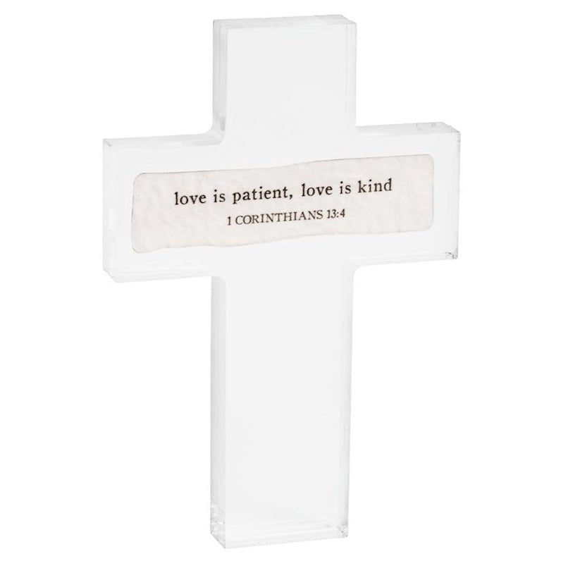 Set of three cross-shaped signs with inspirational quotes on a white background