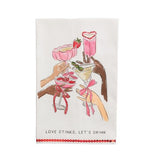 Cotton towel with cocktail glasses illustration and red sequin trim featuring the phrase “Love Stinks, Let’s Drink.”