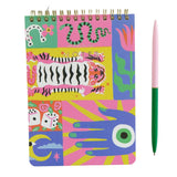 Colorful notebook with animal illustrations on a white surface