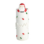White ceramic bud vase with Santa figurine and Christmas lights detail.
