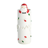 White ceramic bud vase with Santa figurine and Christmas lights detail.