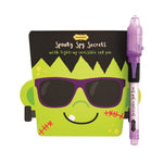 A packaged monster-themed invisible ink pad with a purple light-up pen, designed for kids' activities and visible against a white background.