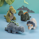 Set of four dinosaur plush toys in soft faux fur with weighted bases