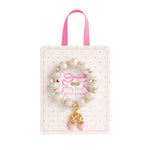 pink and white beaded stretch bracelets for kids with ballet slipper and bow enamel charms on display cards