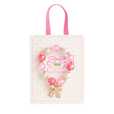 pink and white beaded stretch bracelets for kids with ballet slipper and bow enamel charms on display cards