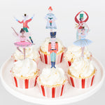 Nutcracker Ballet cupcake kit with character toppers and red, pink, and white striped cases in stage-themed box
