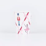 Nutcracker Ballet paper cups with dancers, toy soldiers, and festive ribbon bows in red, pink, and gold