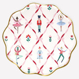 Nutcracker Ballet paper plates with gold foil trim and dancers, nutcracker, and bow design