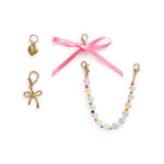 4-piece pastel and bow-themed shoe charm set with gold accents