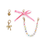 4-piece pastel and bow-themed shoe charm set with gold accents
