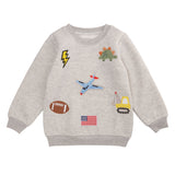 Gray toddler sweatshirt with felt and boucle patches of football, dinosaur, plane, and more