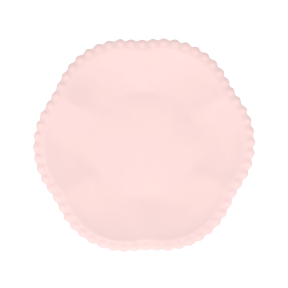 Light pink compostable party plate with scalloped edge, made from bamboo and sugarcane pulp