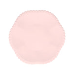 Light pink compostable party plate with scalloped edge, made from bamboo and sugarcane pulp