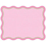 Pink scalloped-edge paper placemat with green trim and subtle linen texture