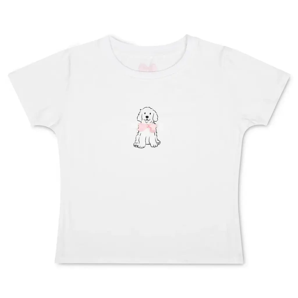White children’s t-shirt featuring a cute puppy graphic with a pink bow on the front.