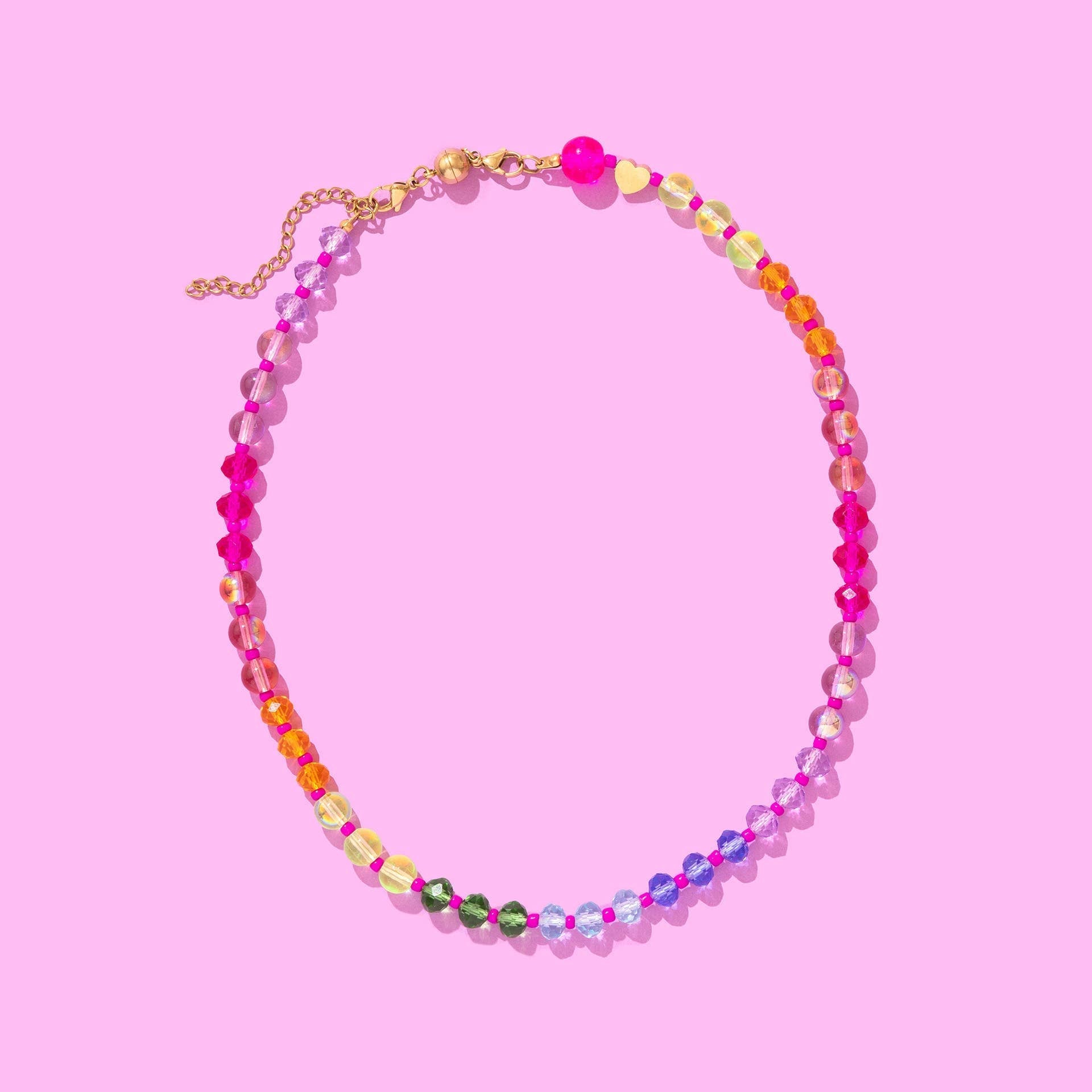 Colorful beaded necklace with magnetic clasp and gold extender, arranged in a rainbow gradient