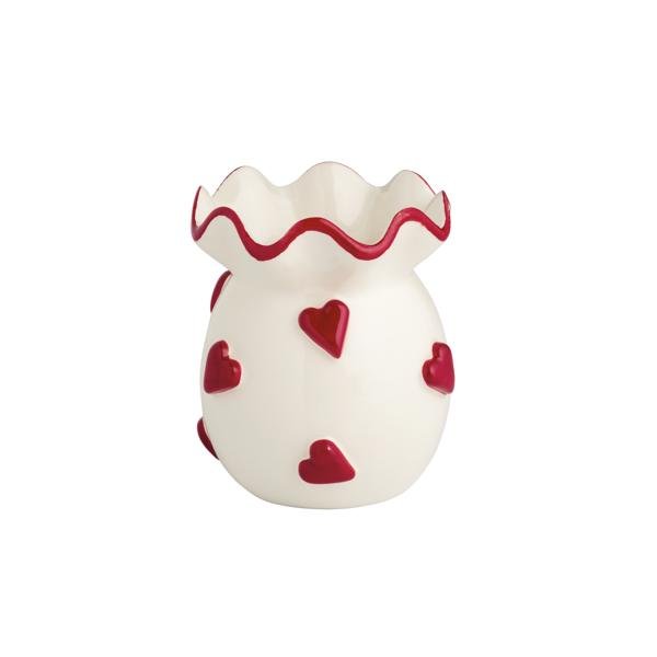 White ceramic vase with raised red hearts and scalloped ruffle edge.