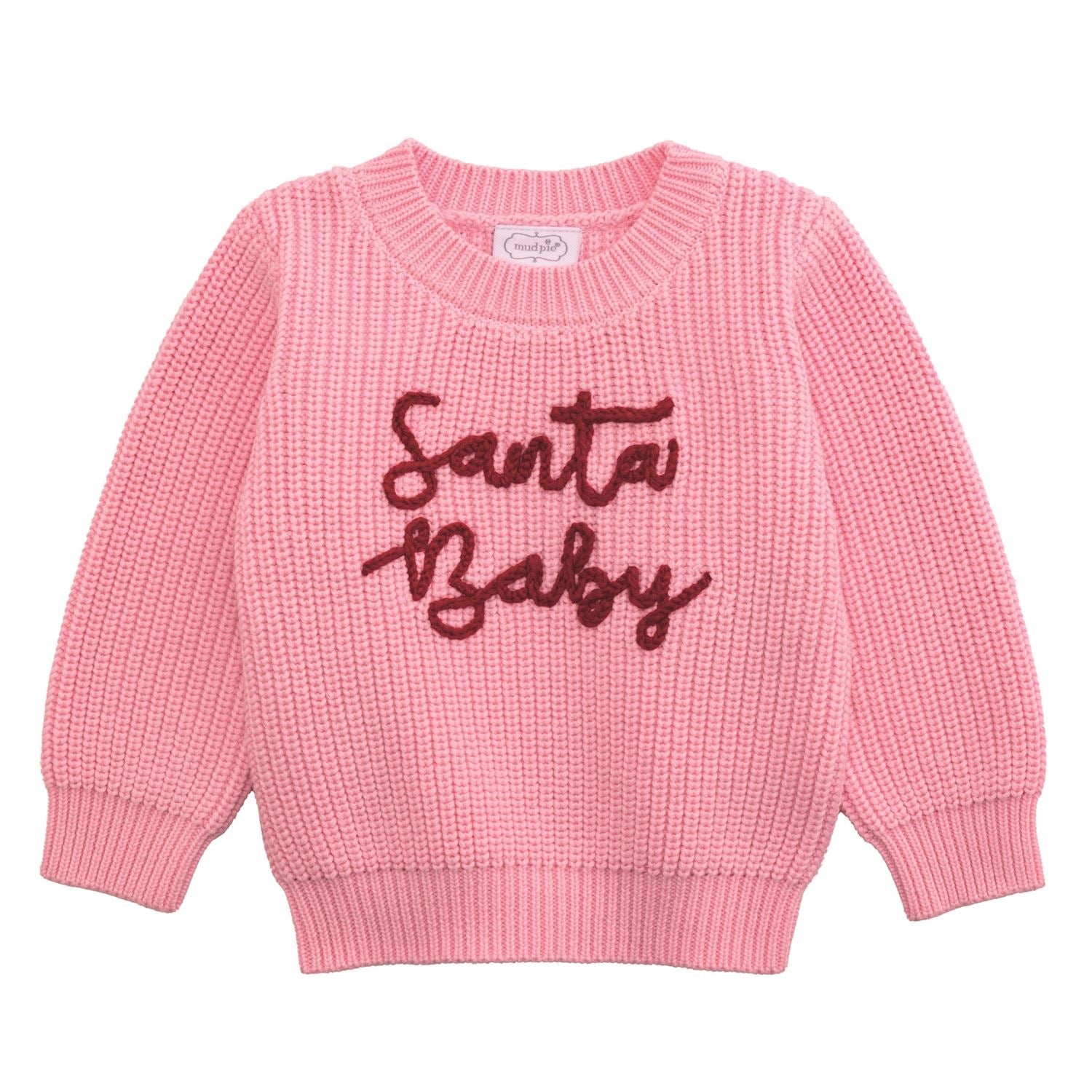 Pink sweater with 'Santa Baby' text on a white background