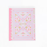 Floral patterned fabric square with pink border on a white background