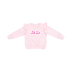 Ruffle shoulder Lil Sis sweatshirt with French terry fabric, playful ruffle accents, and applique text.