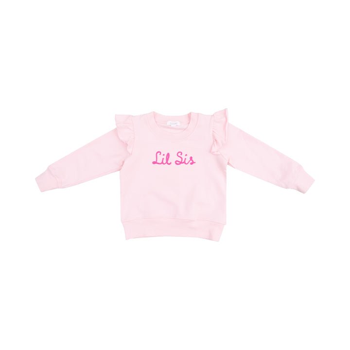 Ruffle shoulder Lil Sis sweatshirt with French terry fabric, playful ruffle accents, and applique text.