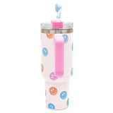 White insulated travel cup with colorful smiley faces, pink handle, and straw with topper