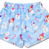 Children’s Corey Paige Snow Days plush shorts with multicolor holiday graffiti-style print, back pocket, and elastic waistband.