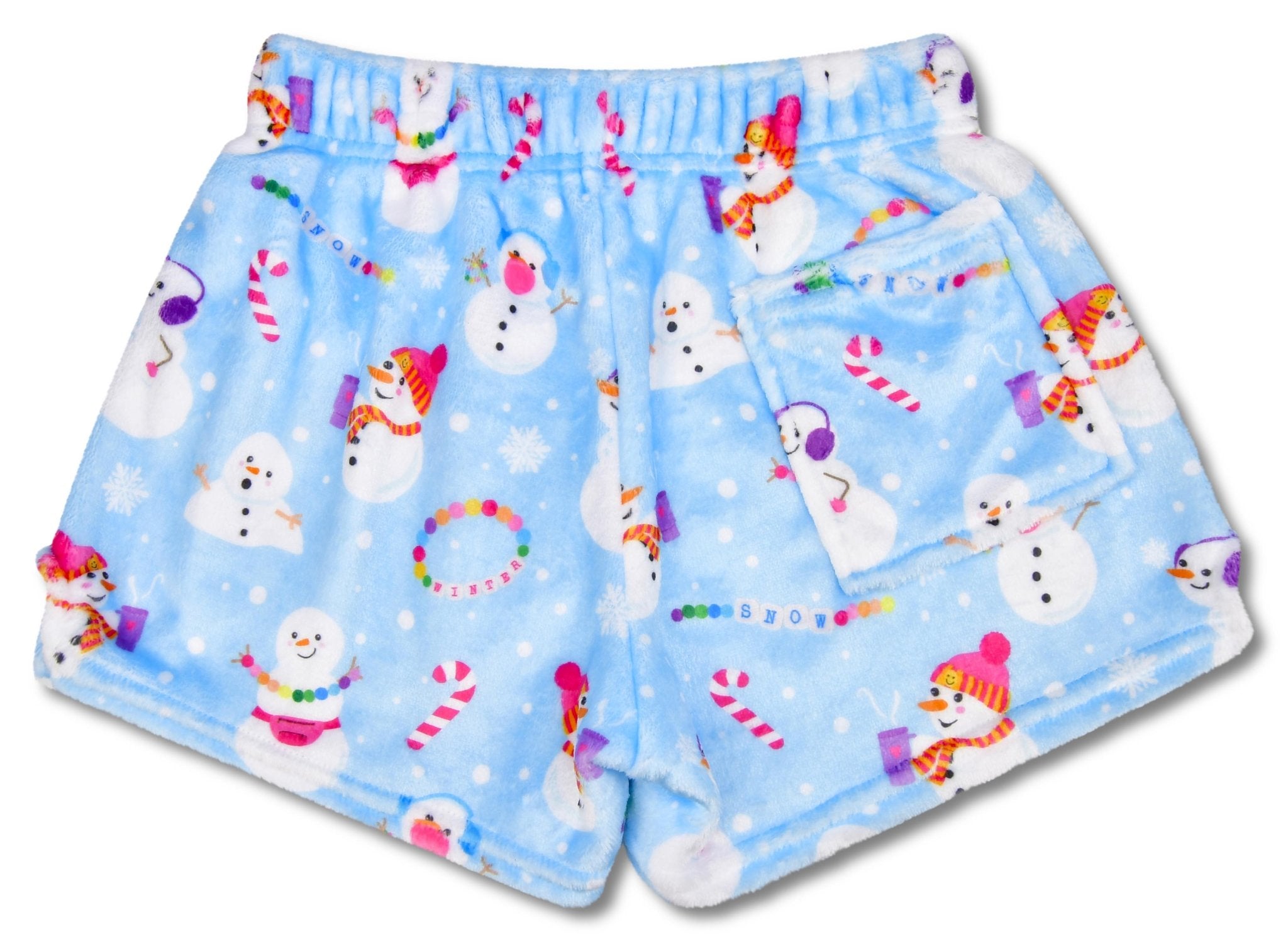 Children’s Corey Paige Snow Days plush shorts with multicolor holiday graffiti-style print, back pocket, and elastic waistband.