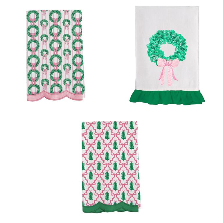 Mary Square Pink Christmas Tea Towels featuring festive wreaths, trees, and bows, sold individually.