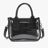Black handbag with clear accents on a white background