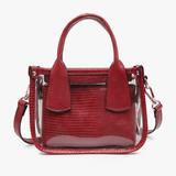 Red handbag with clear accents on a white background