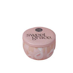 Sweet Grace travel-size tin candle with blush and white pattern