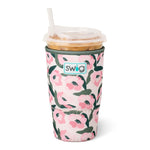 Large floral neoprene iced drink sleeve holding an oversized iced coffee cup