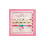 Set of three pink and gold stretch bracelets for girls with 'Cutie Pie' and sweetheart charm in gift box