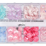 Clear tackle box filled with pink, purple, blue, and iridescent stick-on face gems for kids