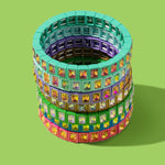  Stack of colorful enamel stretch bracelets with square gemstones in various vibrant colors