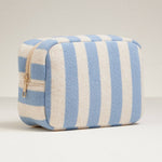 Blue and cream striped terry cloth zip pouch with gold zipper