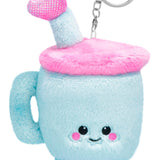 Plush blue travel cup keychain with pink fuzzy lid, smiling face, and sparkly straw and feet