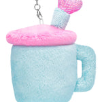 Plush blue travel cup keychain with pink fuzzy lid, smiling face, and sparkly straw and feet