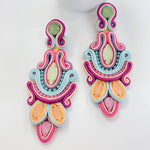 Colorful soutache earrings on a white background
