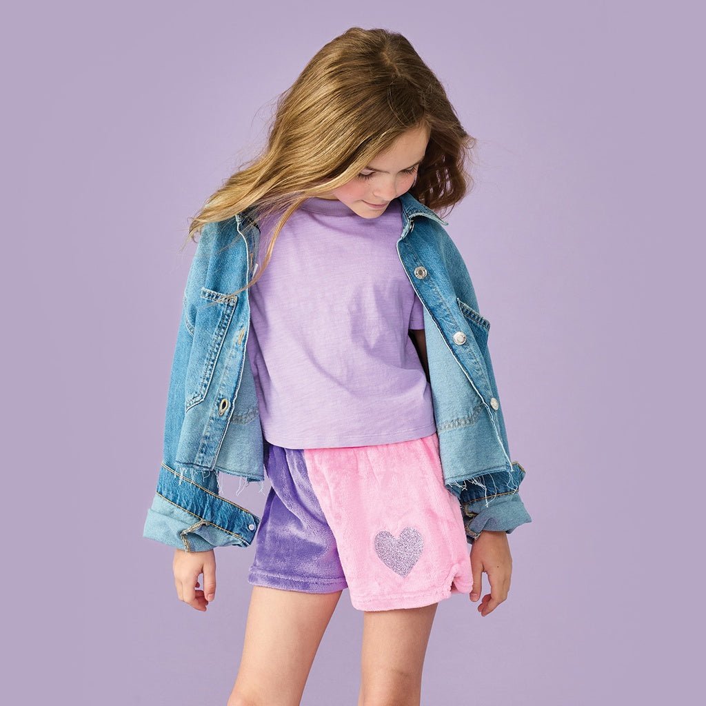 Kids plush shorts with purple and pink color-block design and glitter heart patch