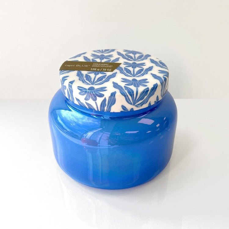 Blue jar with a patterned lid on a white background