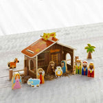 Wooden nativity set with barn and twelve figurines including Mary, Joseph, Baby Jesus, and Wise Men