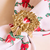 Gold wreath napkin ring by Mary Square, elegant holiday table accessory.